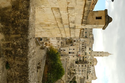 Matera in Italy, world heritage of humanity. Fireplace and dwellings built in beige tuff stone.