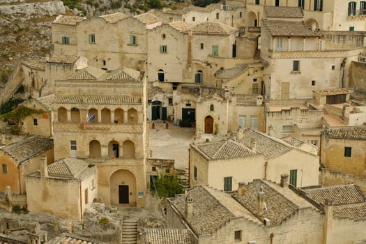 Matera, Basilicata, Italy. About 11/2019. Houses and roofs of the city of Matera in Italy, world heritage of humanity. Homes built in beige tuff stone.
