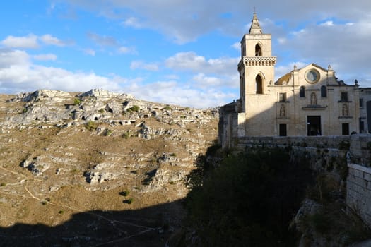 Matera, Basilicata, Italy. About 11/2019. Church of San Pietro Caveoso in Matera. In the background the Mountains with ancient prehistoric caves.