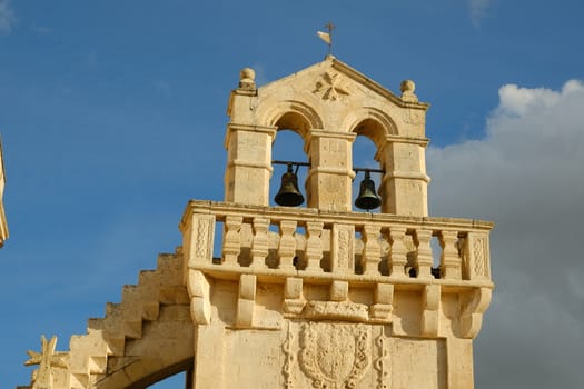 Materdomini Church in Piazza Vittorio Veneto of Matera. Built flat bell tower with balustrade in beige tuff.