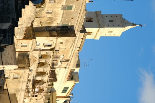 Houses and bell tower in the city of Matera in Italy. The tuff blocks are the material used for the construction of the houses.