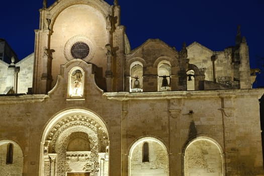 Night photo of the facade of the church of San Giovanni in Matera. Photographed with artificial lights.