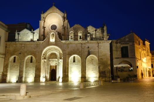 Night photo of the facade of the church of San Giovanni in Matera. Photographed with artificial lights.