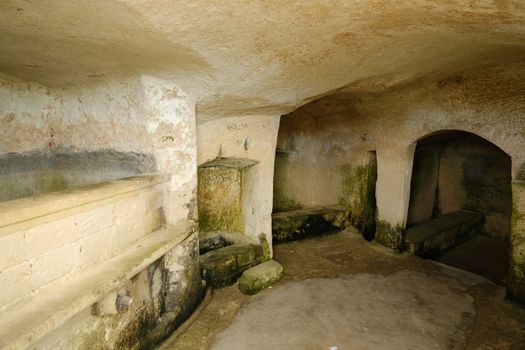 Matera, Basilicata, Italy. About 11/2019. Sassi of Matera with arched ceilings and vaults. Ancient underground house dug out of the tufa rock.