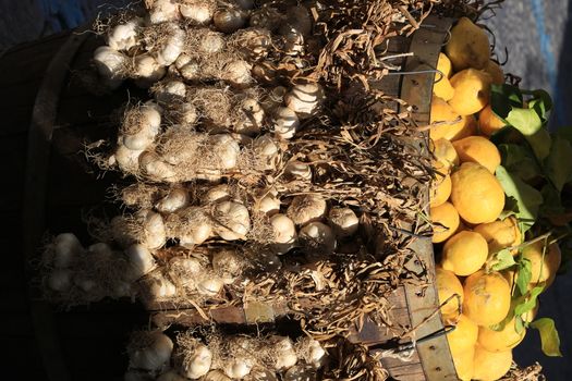 Basket with garlic and lemons for sale in the Island of Ischia, near Naples, Italy.