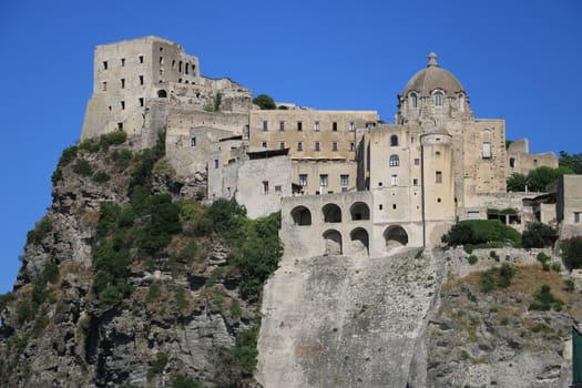 Ancient Aragonese Castle in Ischia Ponte. The fortification stands on a peninsula of volcanic rock connected to the village of Ponte. Ischia, Naples, Italy. 