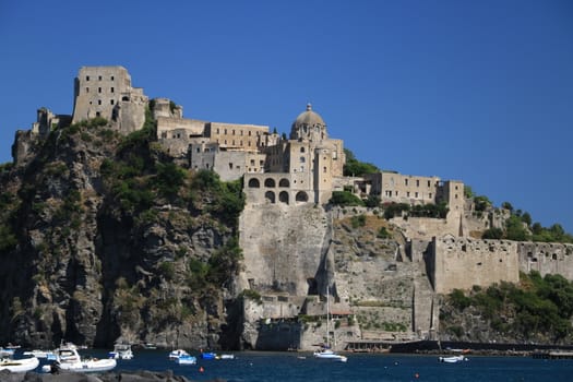 Ancient Aragonese Castle in Ischia Ponte. The fortification stands on a peninsula of volcanic rock connected to the village of Ponte. Ischia, Naples, Italy. 