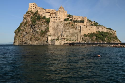 Ancient Aragonese Castle in Ischia Ponte. The fortification stands on a peninsula of volcanic rock connected to the village of Ponte. Ischia, Naples, Italy. 