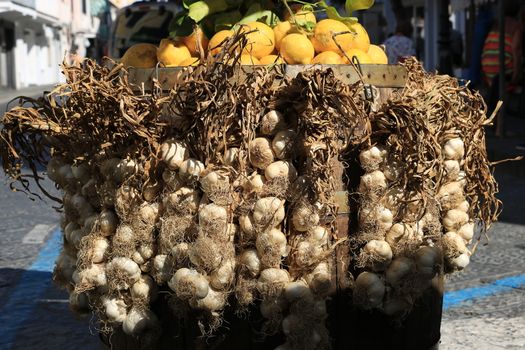 Basket with garlic and lemons for sale in the Island of Ischia, near Naples, Italy.