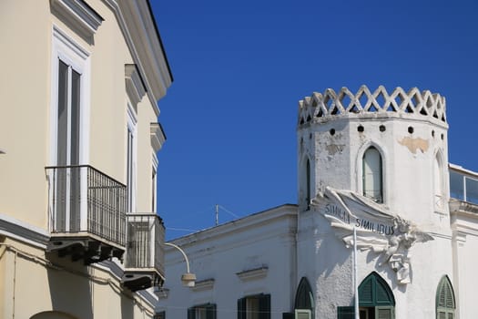 Forio, Ischia, Naples, Italy, About the July 2019. Mediterranean style house with turret on blue sky. On the island of Ischia an eclectic residence in the village of Forio.