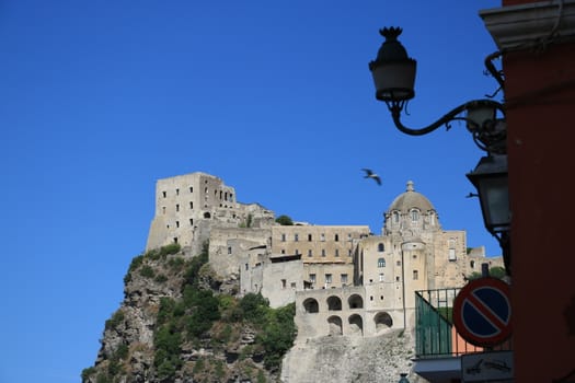 Ancient Aragonese Castle in Ischia Ponte. The fortification stands on a peninsula of volcanic rock connected to the village of Ponte. Ischia, Naples, Italy. 