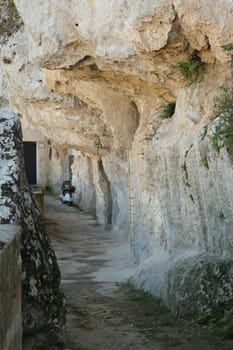 Matera, Basilicata, Italy. About 11/2019. Scooter Vespa Piaggio parked in a cave of the Sassi of Matera in Basilicata.