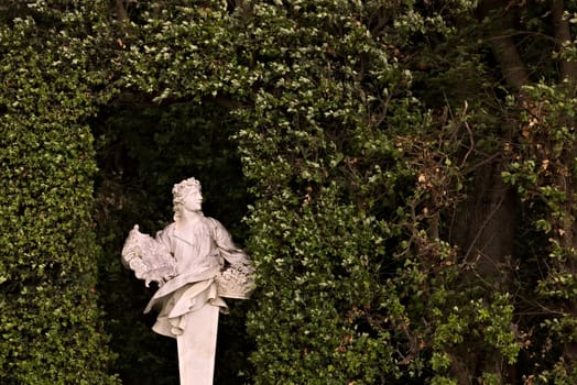 Statue in white marble placed in the park of the palace.