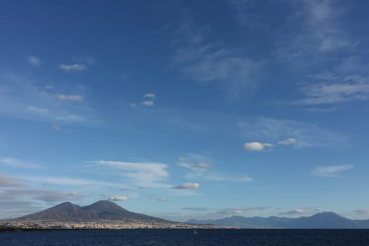 Panorama of the Gulf of Naples with the sea and the volcanic mountain of Vesuvius.