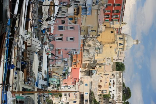 Procida island, Naples, Italy, About the July 2019. Village of Marina Corricella, Procida Island, Mediterranean Sea, near Naples. Colorful houses in the fishing village and boats anchored in the harbor.