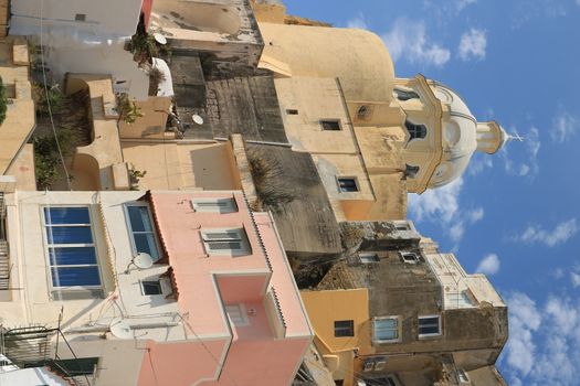 Procida island, Naples, Italy, About the July 2019. Village of Marina Corricella, Procida Island, Mediterranean Sea, near Naples. Colorful houses in the fishing village and boats anchored in the harbor.