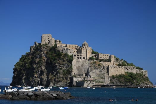 Ancient Aragonese Castle in Ischia Ponte. The fortification stands on a peninsula of volcanic rock connected to the village of Ponte. Ischia, Naples, Italy. 