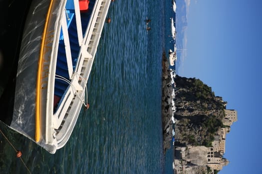 Ischia, Naples, Italy, About the July 2019.  Ancient Aragonese Castle in Ischia Ponte. The fortification stands on a peninsula of volcanic rock connected to the village of Ponte. Boats