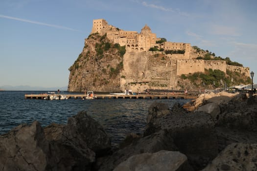 Ancient Aragonese Castle in Ischia Ponte. The fortification stands on a peninsula of volcanic rock connected to the village of Ponte. Ischia, Naples, Italy. 