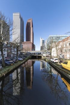 View of the Dutch architecture cityscape reflected on a quiet and calm canal in The Hague, Netherlands