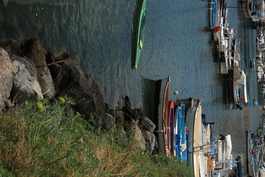 Procida island, Naples, Italy, About the July 2019. Procida Island near Naples. Port of Corricella frequented by fishermen. Typical colorful Mediterranean style houses and fishing boats in the harbor.