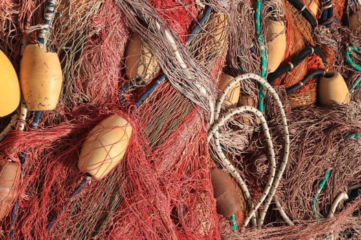 Fishing net stacked in the harbor.