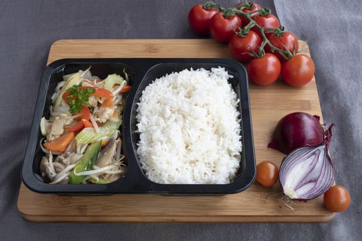 Stir fried chicken served with several type of vegetables as side dish for Chinese meals