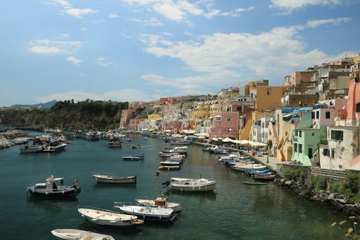 Procida island, Naples, Italy, About the July 2019. Procida Island near Naples. Port of Corricella frequented by fishermen. Typical colorful Mediterranean style houses and fishing boats in the harbor.