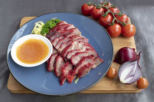 Baked  pork belly service with Chinese cabbage and tomatoe sauce