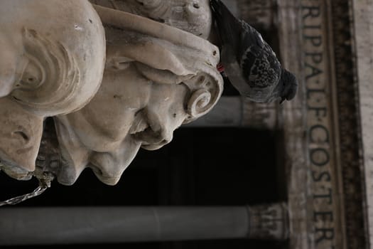 Sculpture with marble fountain in Piazza del Pantheon in Rome. Rome, Italy. 