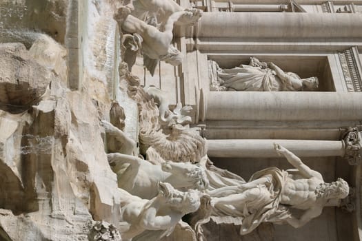 Rome, Italy, About 02/2017. Trevi Fountain with baroque sculptures in travertine marble.