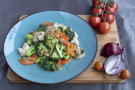 Stir fried chicked with several type of vegetables as side dish for Chinese meals