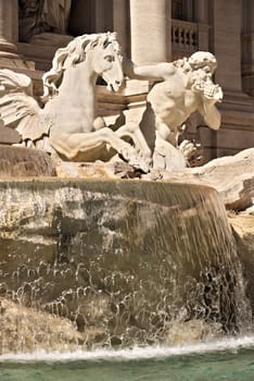 Trevi Fountain in Rome with the sculpture of Neptune. Rome Italy. 05/02/2019. The complex of the fountain built in the Baroque period is built in travertine marble.