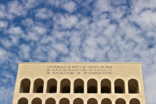 Palace of Italian Civilization built in Rome. Fendi exhibition. Rome Eur, Italy. 05/03/2019. Entirely covered in travertine marble, inspired by the arches of the colosseum. Facade with blue sky background.