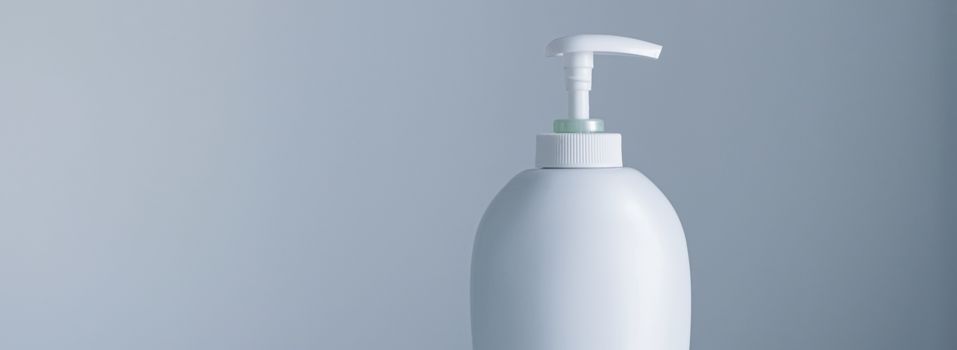 Blank label cosmetic container bottle as product mockup on gray background, hygiene and healthcare