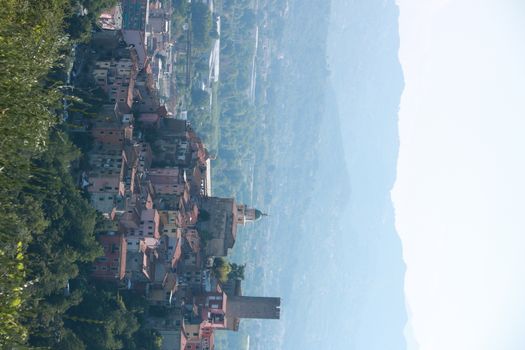 Village of Arcola with the pentagonal tower and in the background the valley of the Magra river and the Apuan Alps.