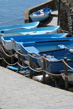 Dry boats parked in the town square during the coronavirus in the Cinque Terre. Stock Royalty Free Photos.