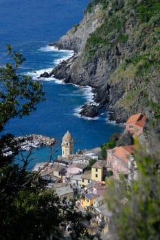 Vernazza, Cinque Terre, La Spezia, Italy. About october 2019. Ancient tower dominates the sea with boats. Vernazza, Cinque Terre, La Spezia, Italy. 