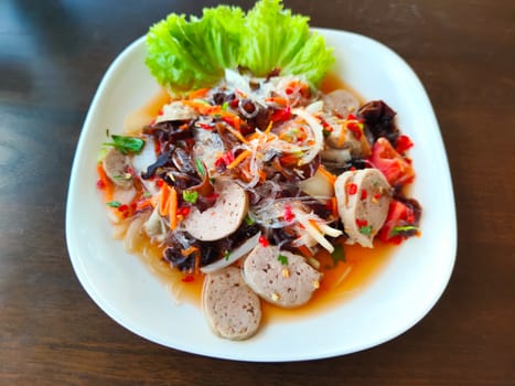 spicy vietnamese sausage salad on white dish