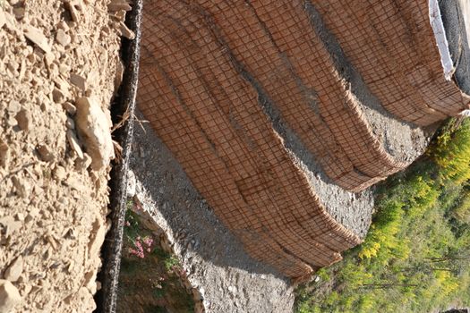 Ground retaining walls made with eco-compatible method.