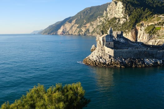 Church of San Pietro in Portovenere near the Cinque Terre. Sea and rocks overhanging the Ligurian sea in Italy.