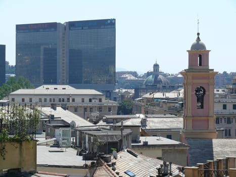 Genova, Italy. About 6/2015. Panorama of Genoa with modern glass buildings and insignia of the CARIGE Bank.