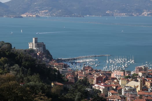 Panorama of the town of Lerici with the sea, the castle, the houses and the tourist port.