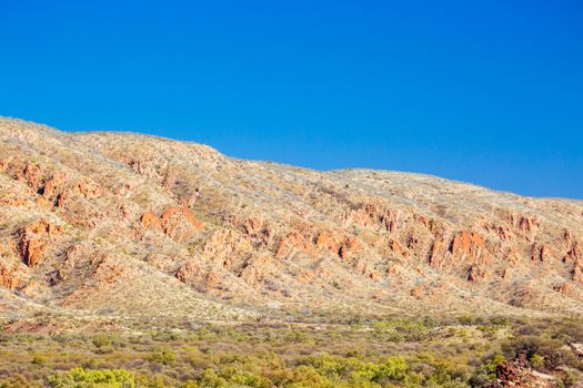 Landscape views of mountain rock faces near Glen Helen in Northern Territory, Australia