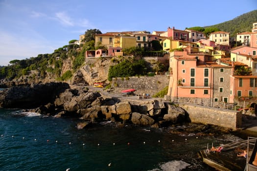 Village of Tellaro di Lerici near the Cinque Terre. View of the village illuminated by the light of the sunset. Houses.