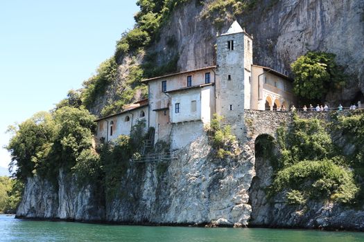 Lake Maggiore, Lombardy, Italy. about June 2019. Hermitage of Santa Caterina del Sasso overlooking Lake Maggiore.