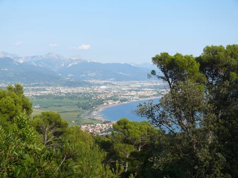 Panorama of Carrara and Apuan Alps with the plain of Marinella seen from the hill of Montemarcello.