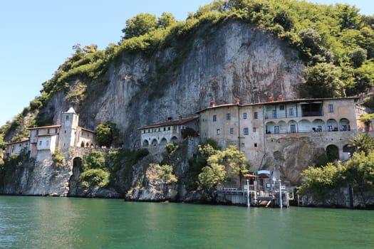 Lake Maggiore, Lombardy, Italy. about June 2019. Hermitage of Santa Caterina del Sasso overlooking Lake Maggiore.