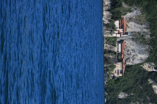 Lake Maggiore, Lombardy, Italy. about June 2019. Hermitage of Santa Caterina del Sasso overlooking Lake Maggiore.