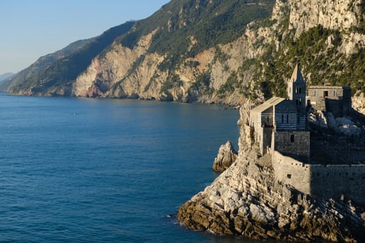 Church of San Pietro in Portovenere near the Cinque Terre. Sea and rocks overhanging the Ligurian sea in Italy.